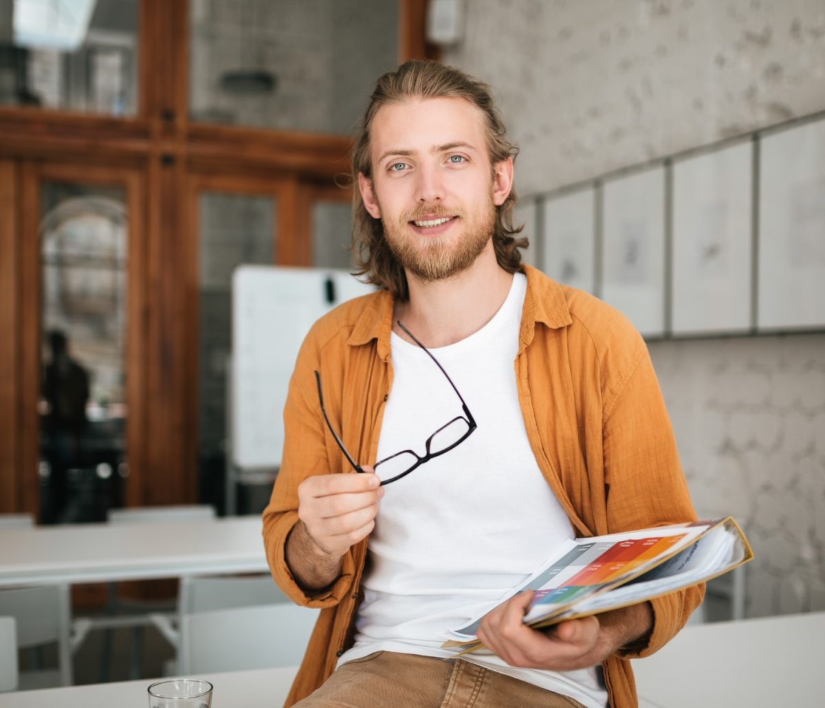 smiling-boy-with-blond-hair-and-beard-joyfully-loo-5USXMTR.jpg